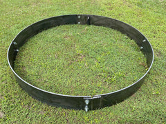 Black metal ring on grass