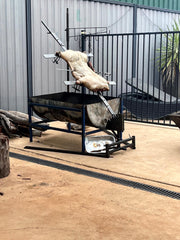 Asado Pig over drum cradle