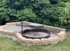 Fire pit with stone surround in a garden setting