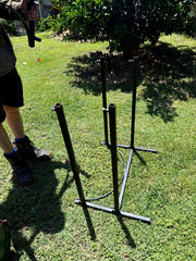 Person setting up Drum Cradle