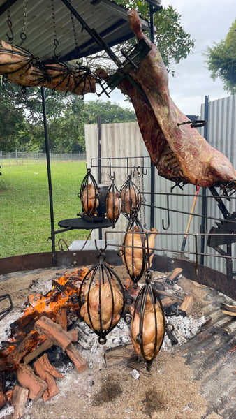 Asada Meat Rack Side_view_of_Asado_in_Fire_Cage_with_Cooking_Cages_grande.jpg?v=1723004925