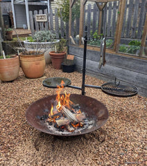 Swinging hot plate and grill system in outdoor kitchen