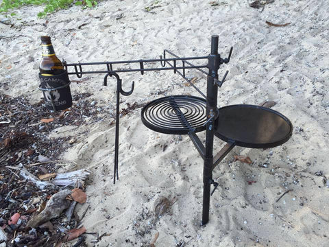 Outdoor cooking, swinging arm cast iron pot hanger