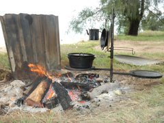 Swinging hot plate and grill assembly with all accessories laid out