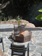 Swinging hot plate and grill in outdoor kitchen setup