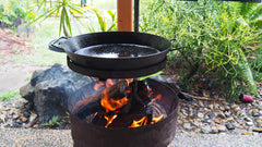 www.aussiecampfirekitchens.com the ACK BBQ PAN over the camping fire pit using the BBQ PAN CRADLE. 100% Australian Made Cooking Gear www.aussiecampfirekitchens.com