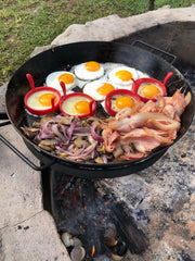 BBQ Pan sitting on cradle over fire pit