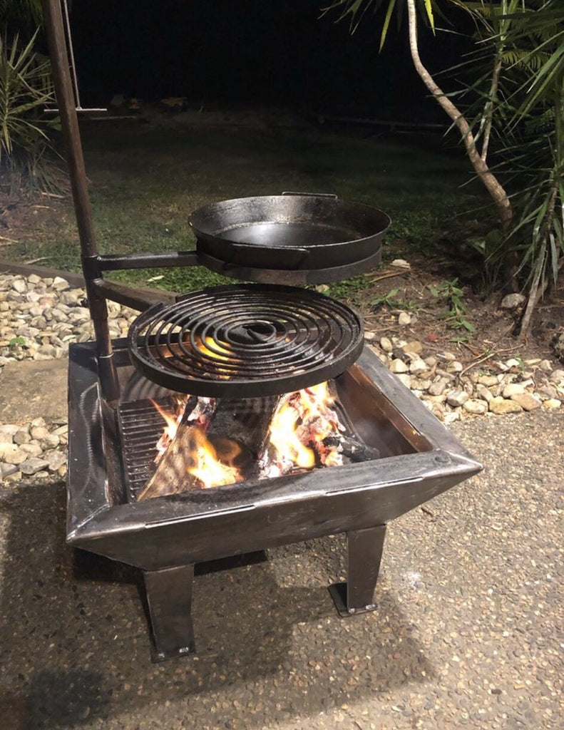 www.aussiecampfirekitchens.com AUSTRALIAN HANDCRAFTED Cooking Gear BACKYARD FIRE PIT with SWINGING GRILL, CRADLE & BBQ PAN.