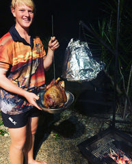 The eldest of the ACK Lads cooking a BELL OVEN roast lamb in his www.aussiecampfirekitchens.com Fishing Shirt 